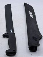 Full view of machete and sheath