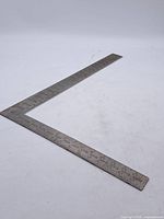 Full view of L-shaped Stanley AR100 steel square showing overall form