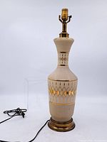 Full view of glass lamp base with cord and socket