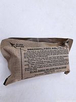 Front view of sealed field dressing pouch showing printed information