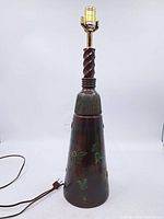 Full view of painted plaster table lamp base with cord