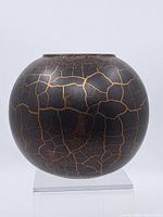 Front view of spherical crackle-glazed vase