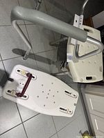 Overview showing toilet safety frame, shower chair seat and bathtub transfer seat