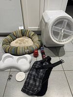 Group shot of all items arranged on tiled floor