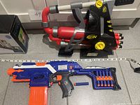 All three items: two Nerf blasters and Duck Line Up box