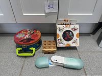 Group shot: Zoob box, wooden tic tac toe game, Toy Story tin, oblong card case