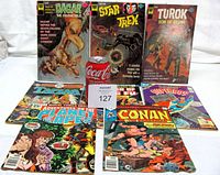 Front covers of all eight comics displayed upright and flat