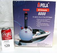 Front view of PELA Oil Extractor 6000 retail box with product image and capacity details