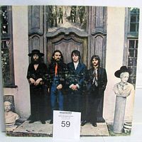 Front sleeve showing full cover art and lot number card