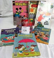 Front view showing all seven Whitman Disney comics