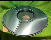 Assembled aluminum reflector shield with screw packet at center