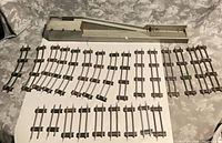 Overall lot with track pieces and lumber loader