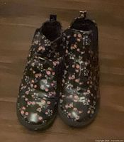Front view of both floral ankle boots