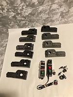 All 12 Lionel 1122 switch controller parts laid out