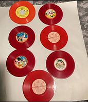Overview of seven colored vinyl records