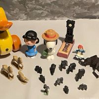 Overall group with duck, Peanuts figures, animals and tower