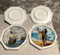 Both plates in open hexagonal foam boxes, showing ship scene and Native American chief scene