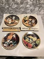 Four decorative plates two boxed overview