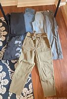 All six pants and jeans laid out showing colors and styles