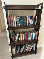 Front view showing entire wooden bookcase with three shelves