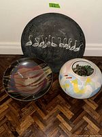 All three items: metal plate, ceramic bowl, ceramic vase