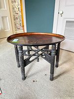 Full view folding tray table showing wood base and oval metal tray