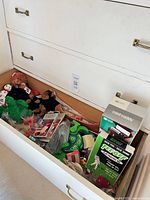 Open drawer showing entire assortment of vintage toys, games, plush and accessories