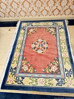 Top view of full rug showing design, colors and fringe