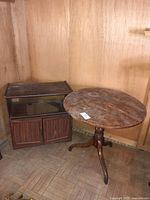 Round table and cabinet together showing size and style