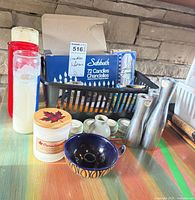 Group shot showing all candle holders, boxed candles and votives