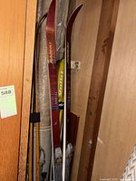 Full view of Karhu skis, ski poles, partial boots