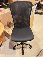 Full view of black mesh armless office chair