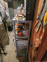 Full view of single shelving unit beside furnace