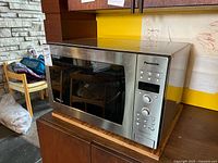 Front and side view of Panasonic stainless steel countertop microwave oven