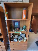 Full view of teak veneer bookcase showing three shelves and three drawers