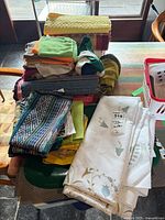 Pile of assorted table linens on table