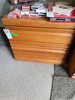 Front view of two-drawer wood nightstand