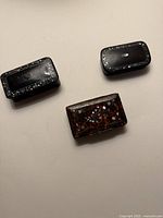 Three snuff boxes front view