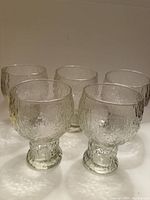 Five Indiana Glass Glacier goblets front view