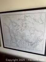 Full view of framed British North America map on wall