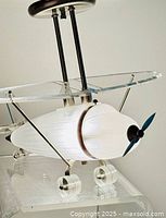 Full side view showing complete airplane light fixture