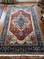 Full view of Persian rug showing entire pattern and fringe
