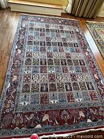 Full view of Persian rug showing overall pattern and size