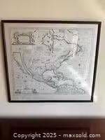 Full view of framed map print on wall
