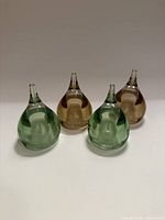 Front view of all four teardrop shakers, showing colors and shape