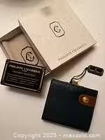 Wallet, box, dust bag and card overview