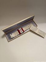 Watch in open Timex box with leaflet visible