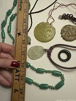 All jewellery pieces laid out showing shapes, colors, cords and beads