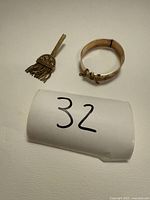 Both jewellery pieces together: tassel brooch and bangle