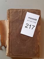 Front cover showing detached spine and board